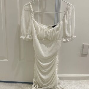 Privy White Textured short Sleeve Dress. Ruching on side. Size large